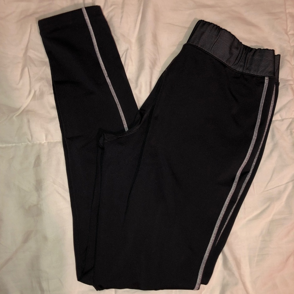 Black, athletic material leggings